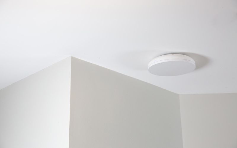 Ceiling-mounted wireless access point providing whole-home Wi-Fi coverage