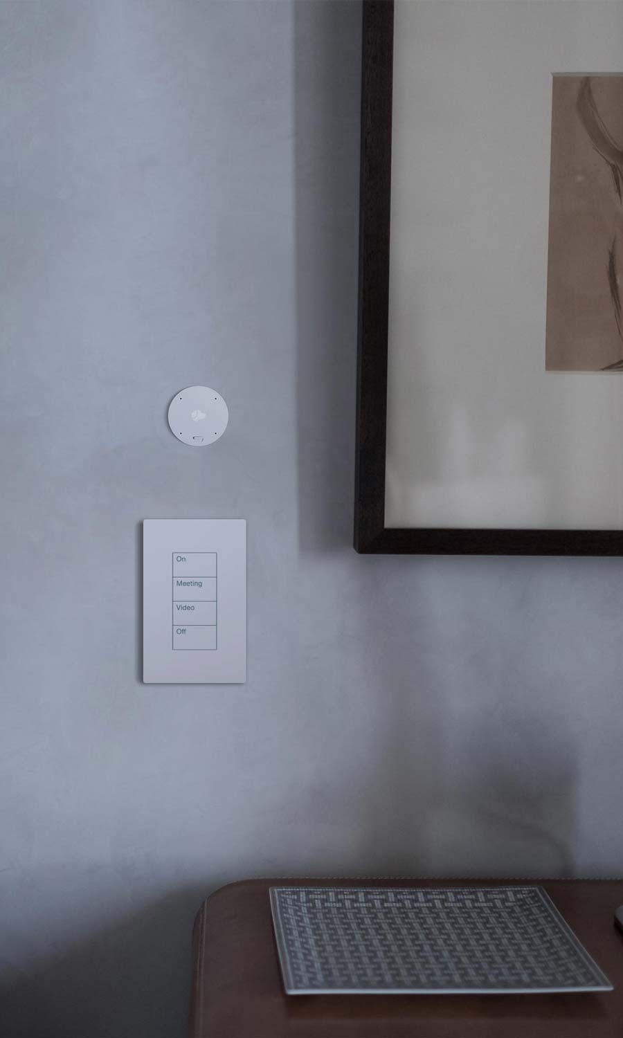 White Lutron keypad paired with a Josh Nano on a gray plaster wall.