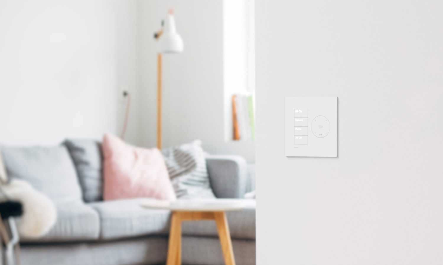 White Lutron Palladiom keypad with Josh.ai integration in a living area.