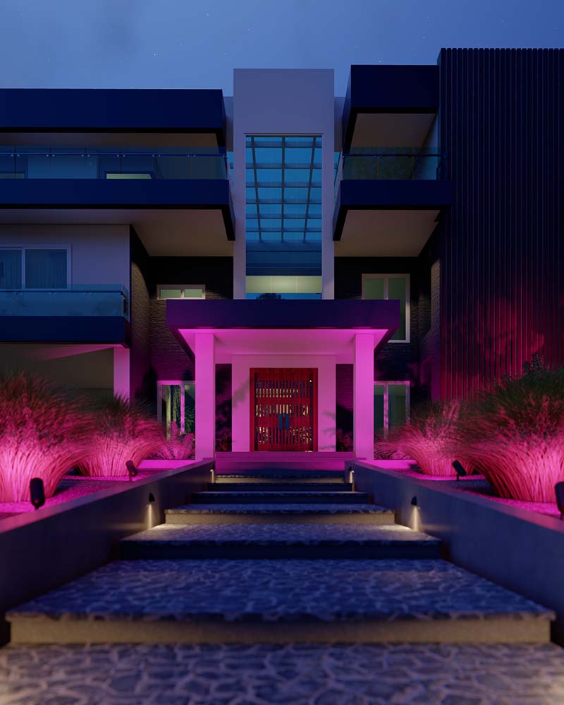 Modern home exterior illuminated by vibrant pink Coastal Source Ketra lights.