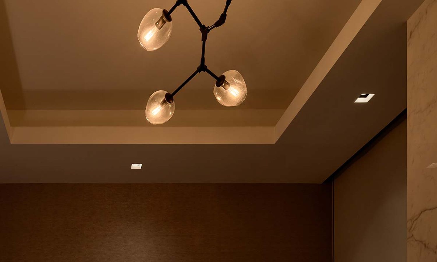 Modern branching chandelier dimmed perfectly with Lutron lighting control.