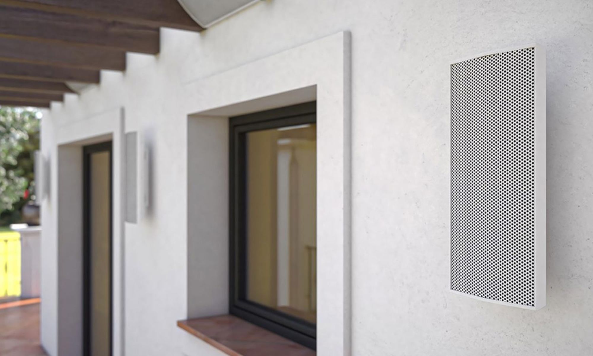 Modern white rectangular outdoor speaker mounted on a textured wall
