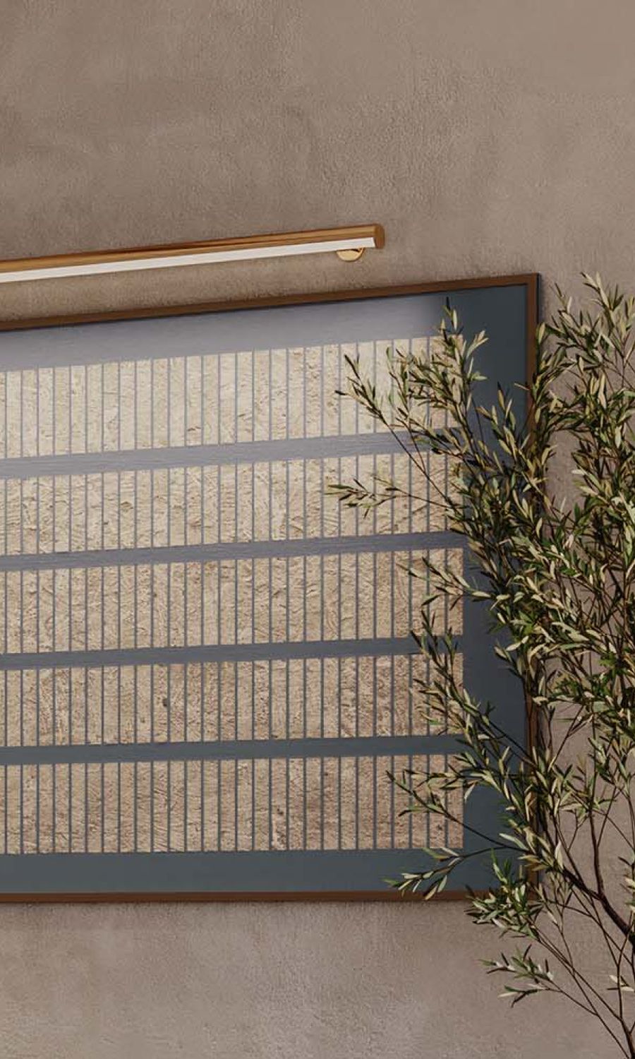 Brass Lutron picture light illuminating abstract artwork over firewood.