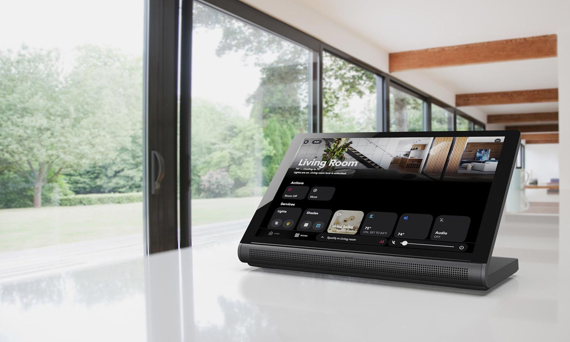 Smart home control tablet on a counter showing a living room interface